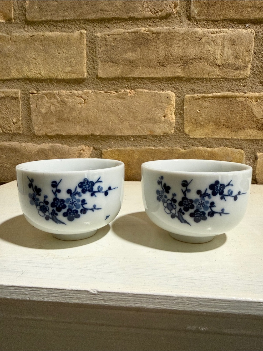White Porcelain Tea Bowls with Blue Floral Motif